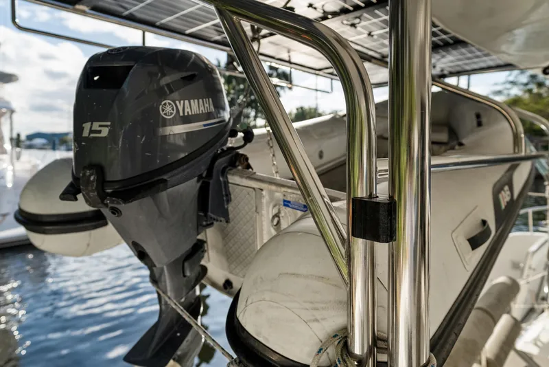 Slide: The Image of Yamaha 15 outboard motor on 2020 Lagoon 42 catamaran, docked by the water. - 5