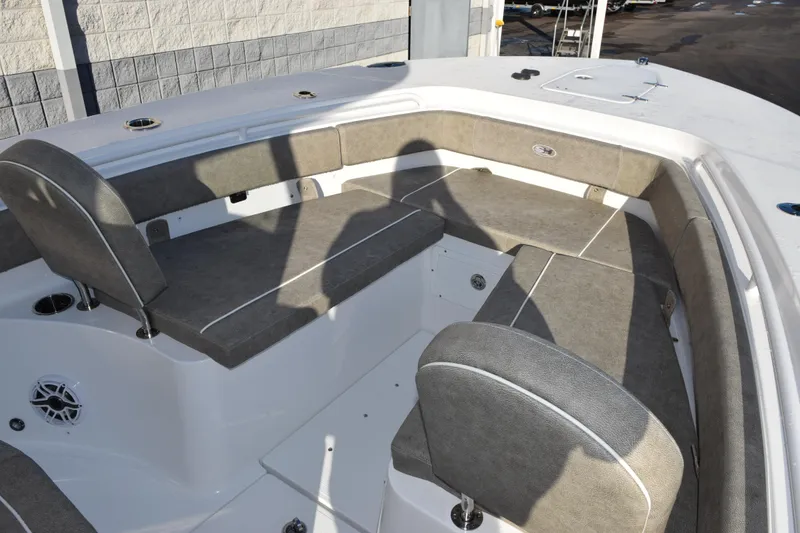 Slide: The Image of 2026 Sea Hunt Gamefish 25 boat interior with cushioned seating and storage compartments. - 12