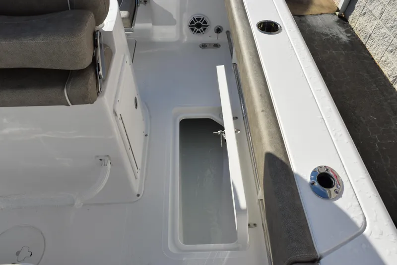 Slide: The Image of 2026 Sea Hunt Gamefish 25 boat interior with open storage compartment and seating. - 15