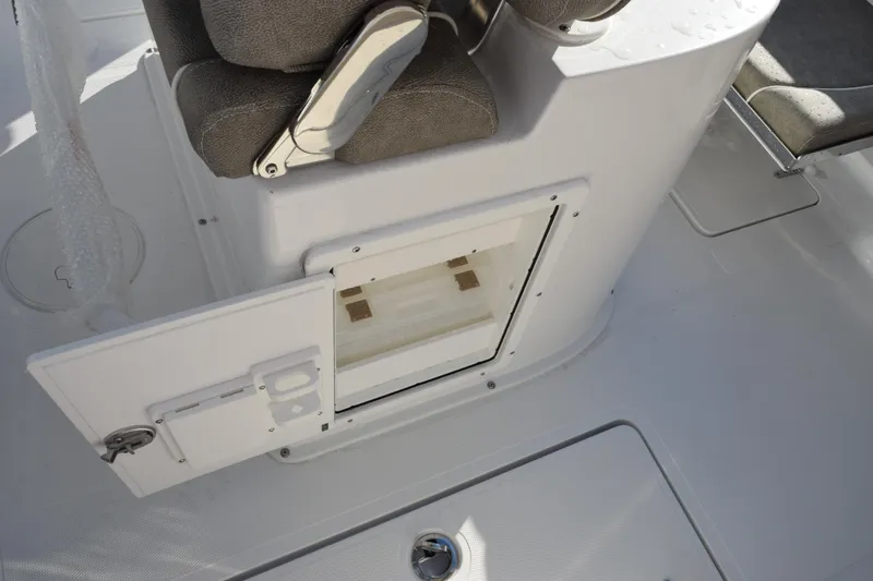 Slide: The Image of 2026 Sea Hunt Gamefish 25 boat interior with open storage compartment. - 16