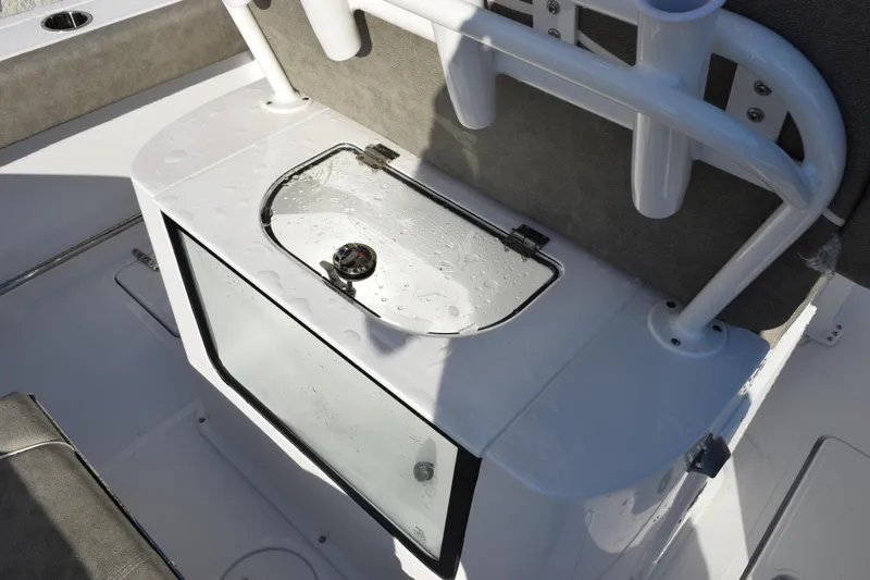 Slide: The Image of 2026 Sea Hunt Gamefish 25 boat interior with livewell and rod holders. - 8