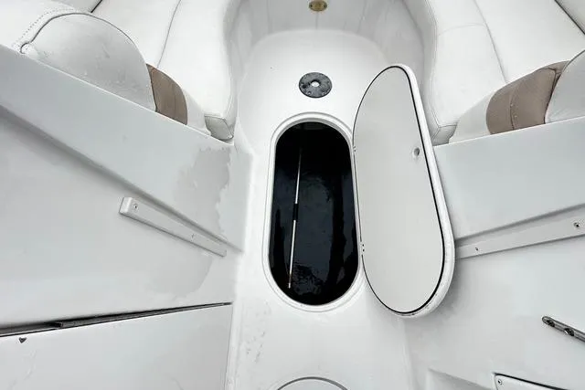 Slide: The Image of 2005 Starcraft Aurora 2210 OB boat interior with open storage compartment. - 11