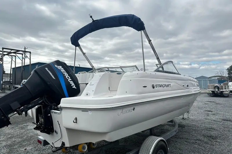 Slide: The Image of 2005 Starcraft Aurora 2210 OB boat with Mercury outboard motor on trailer. - 3