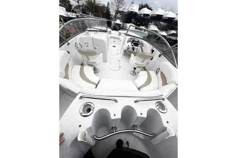 Slide: The Image of 2005 Starcraft Aurora 2210 OB boat interior with seating and steering console. - 4