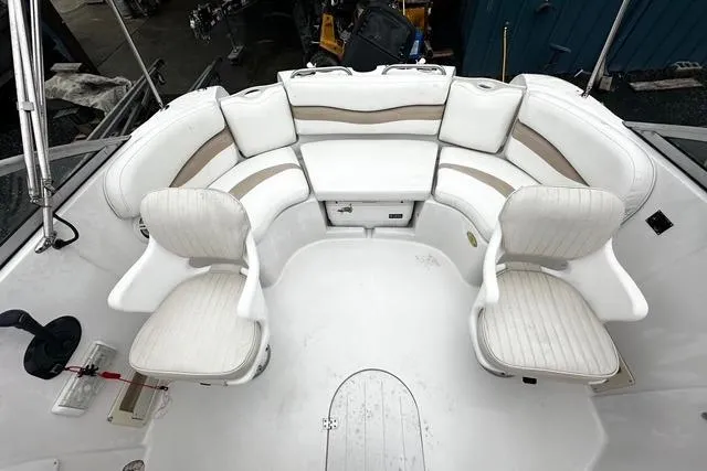 Slide: The Image of 2005 Starcraft Aurora 2210 OB boat interior with white seating arrangement. - 8