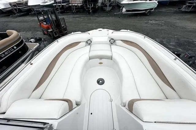 Slide: The Image of 2005 Starcraft Aurora 2210 OB boat with spacious white seating area. - 9