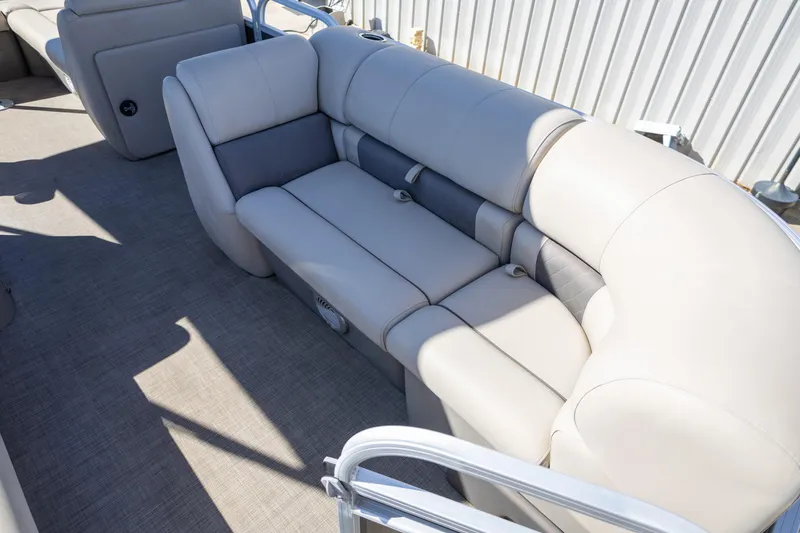 Slide: The Image of 2023 Sun Tracker Party Barge 20 DLX interior seating with beige upholstery. - 8