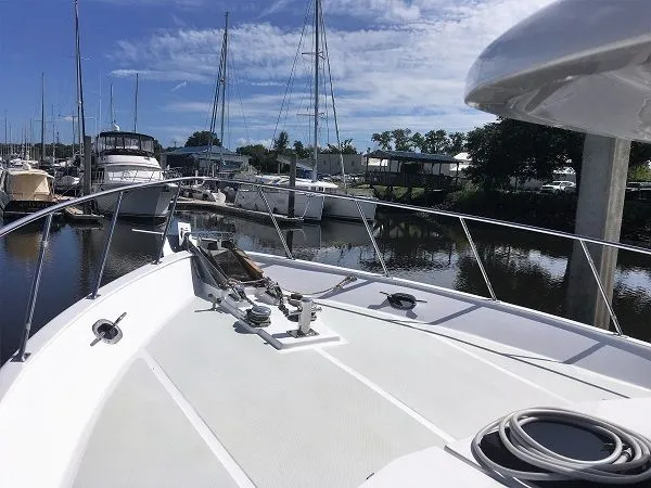 Slide: The Image of 2005 DeFever 44+5 yacht docked in marina. - 10