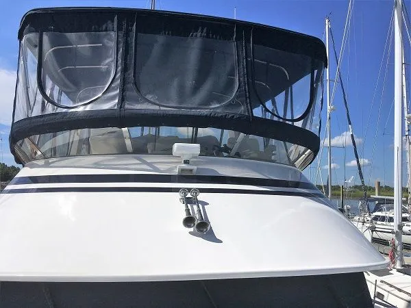 Slide: The Image of 2005 DeFever 44+5 yacht docked, front view. - 14