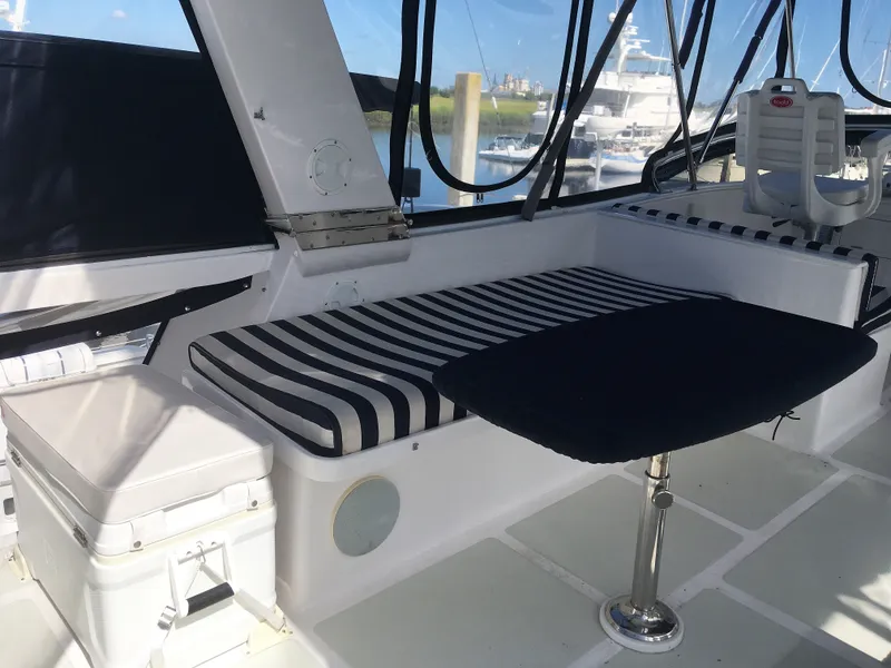 Slide: The Image of Interior of a 2005 DeFever 44+5 yacht with seating area. - 17