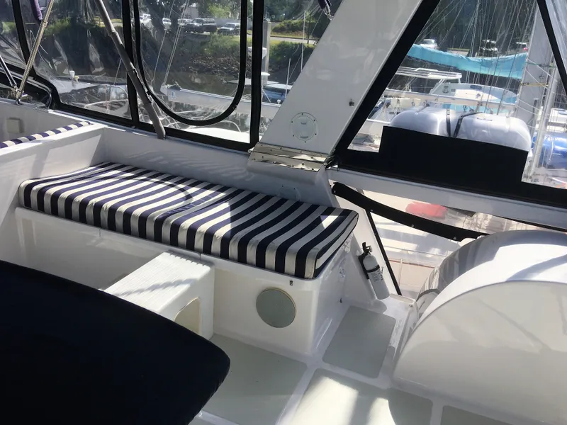 Slide: The Image of Interior of a 2005 DeFever 44+5 yacht with striped seat cushion. - 18