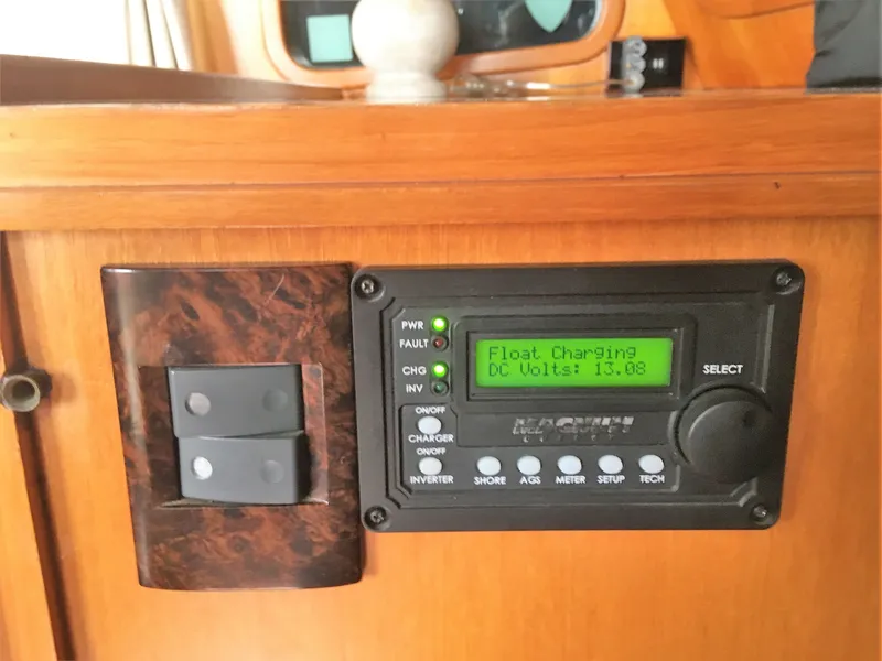 Slide: The Image of Magnum charger on 2005 DeFever 44+5 displaying 13.08 DC volts. - 36