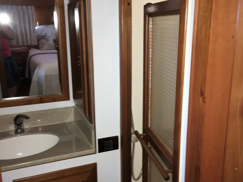 Slide: The Image of 2005 DeFever 44+5 yacht bathroom with sink and shower. - 42