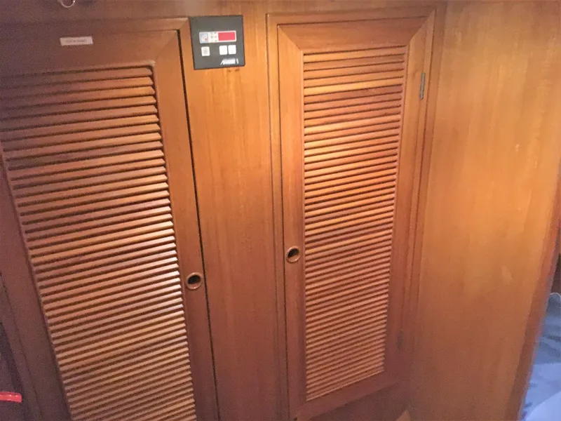 Slide: The Image of Wooden cabinet doors in a 2005 DeFever 44+5 yacht. - 45