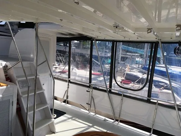 Slide: The Image of Interior of a 2005 DeFever 44+5 yacht overlooking the marina. - 8