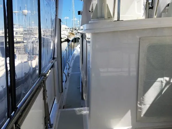 Slide: The Image of Side deck of 2005 DeFever 44+5 yacht in marina. - 9