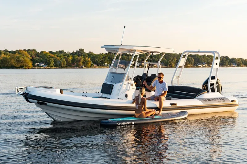 Slide: The Image of Highfield Escape 750 boat on calm water, 2026 model. - 4