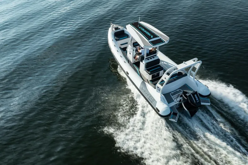 Slide: The Image of 2026 Highfield Escape 750 boat cruising on open water, showcasing sleek design and performance. - 8