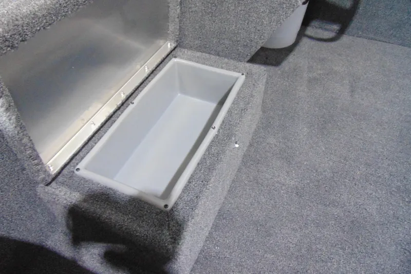 Slide: The Image of Carpeted storage compartment in 2026 Crestliner 1600 Storm boat interior. - 10