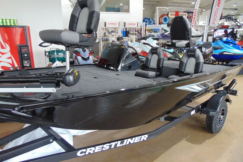 Slide: The Image of 2026 Crestliner 1600 Storm fishing boat displayed indoors, featuring comfortable seating and sleek design. - 3