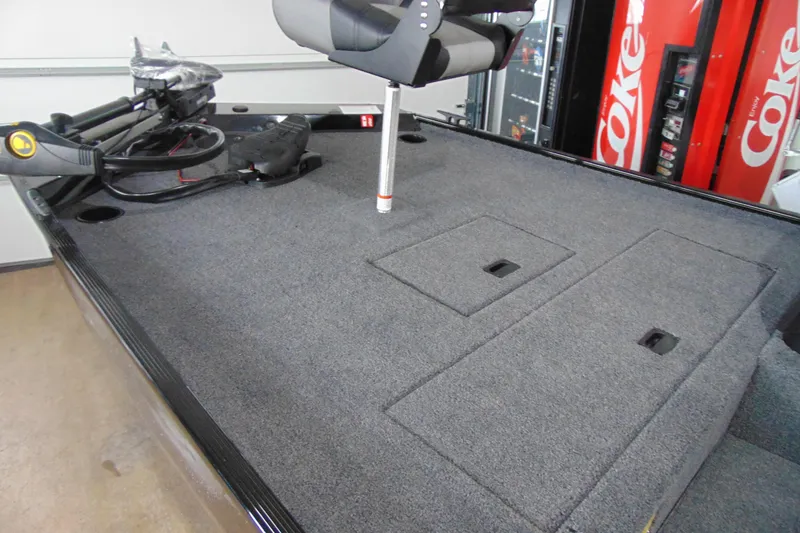 Slide: The Image of 2026 Crestliner 1600 Storm boat deck with storage compartments and trolling motor. - 4