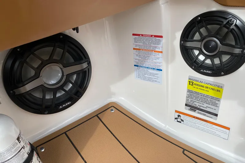 Slide: The Image of Interior of 2022 Chaparral 247 SSX with JL Audio speakers and safety labels. - 10