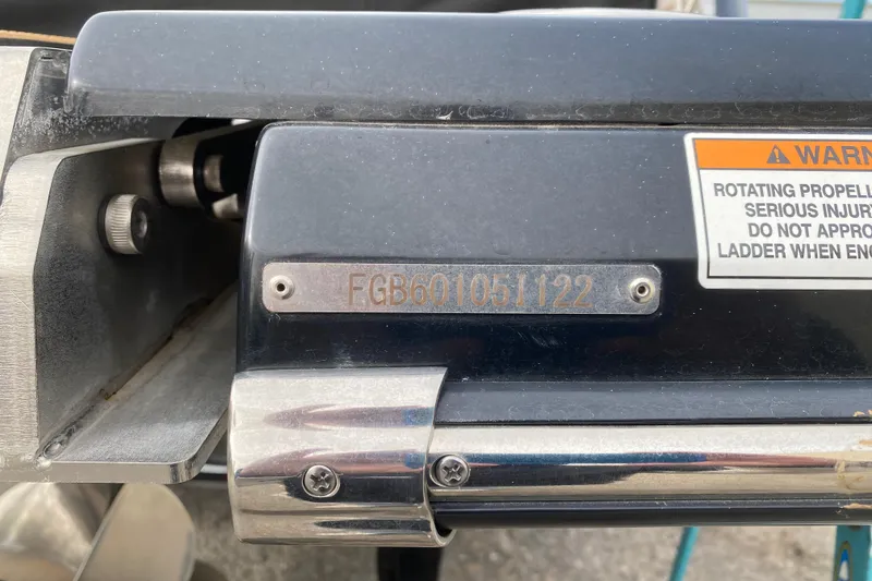 Slide: The Image of 2022 Chaparral 247 SSX boat detail with warning label and serial number plate. - 13