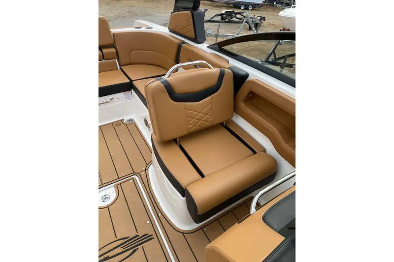 Slide: The Image of 2022 Chaparral 247 SSX boat interior with tan leather seating and sleek design. - 5