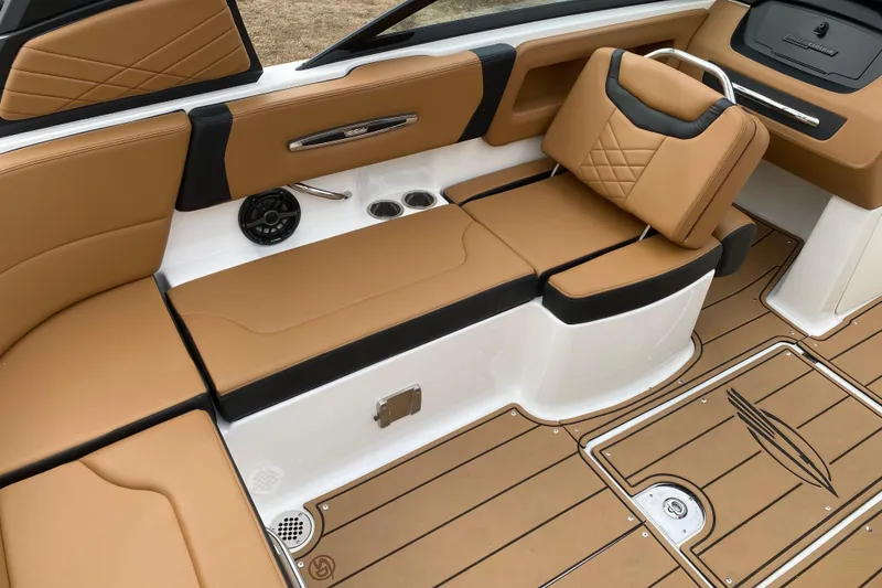 Slide: The Image of 2022 Chaparral 247 SSX boat interior with tan leather seating and modern design. - 7