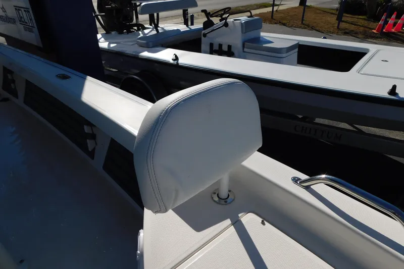 Slide: The Image of 2026 Pathfinder 2200 TRS boat interior with white seating and sleek design. - 24