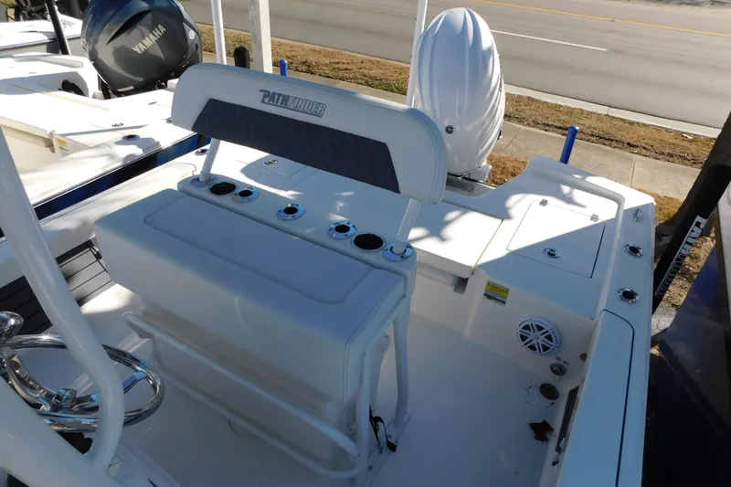 Slide: The Image of 2026 Pathfinder 2200 TRS boat interior with seating and Yamaha engine. - 3