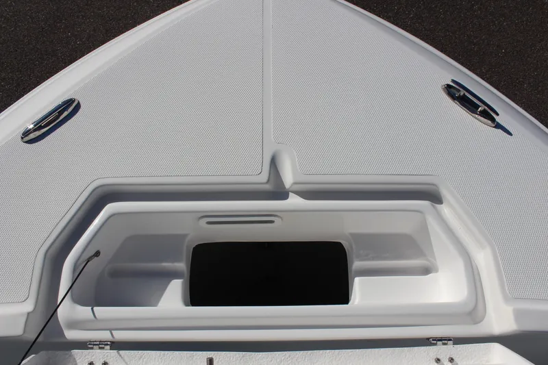Slide: The Image of 2024 Clearwater 2300 CC boat deck with storage compartment and cleats. - 5