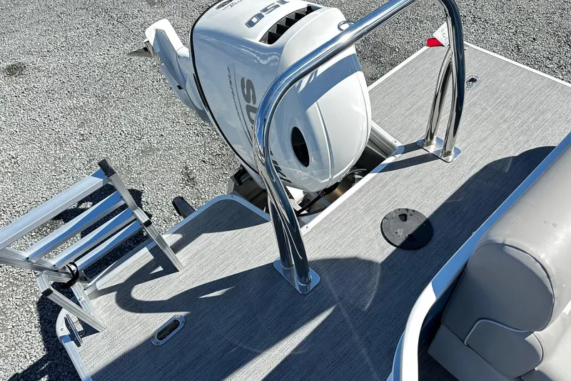 Slide: The Image of 2025 Godfrey Experience Cruise 2086CX boat with outboard motor and ladder on deck. - 12