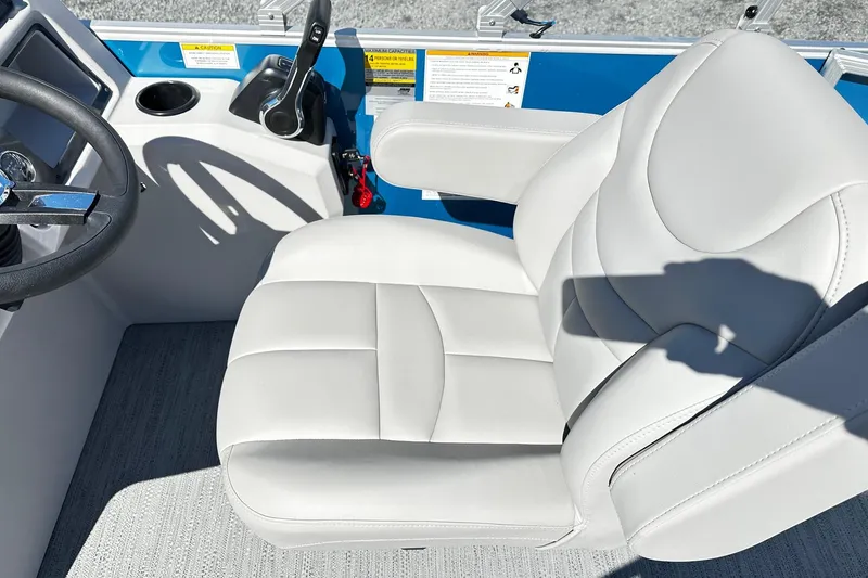 Slide: The Image of Captain's seat and controls of 2025 Godfrey Experience Cruise 2086CX pontoon boat. - 8
