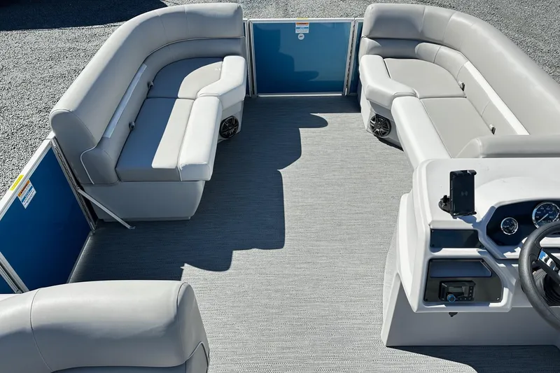 Slide: The Image of 2025 Godfrey Experience Cruise 2086CX pontoon boat interior with plush seating and modern dashboard. - 9