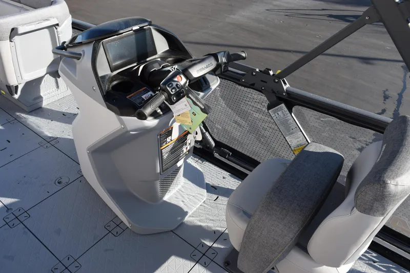 Slide: The Image of 2026 Sea-Doo Switch Cruise 21 dashboard and seating area, featuring modern controls and design. - 13