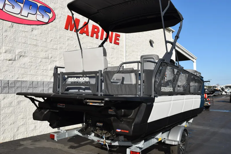 Slide: The Image of 2026 Sea-Doo Switch Cruise 21 pontoon boat displayed at a marine dealership. - 4