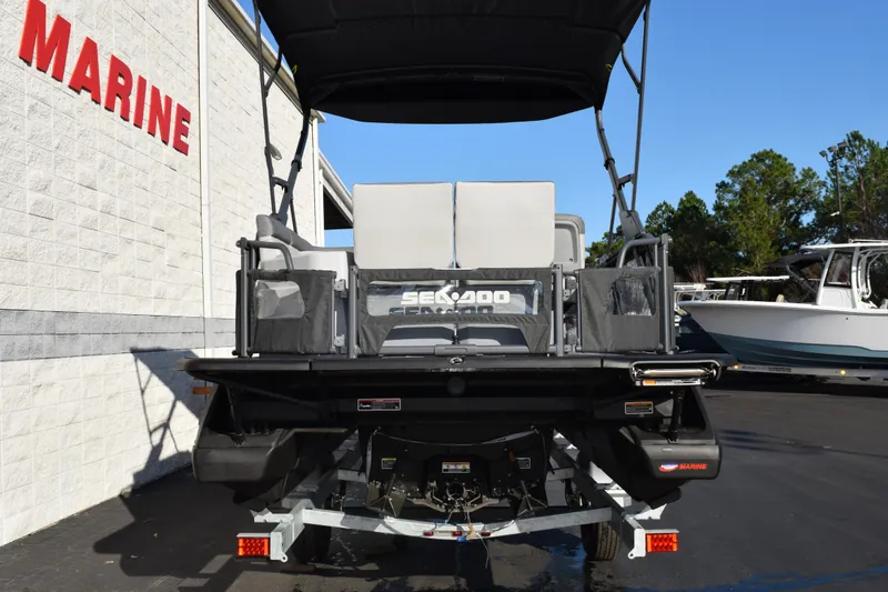 Slide: The Image of 2026 Sea-Doo Switch Cruise 21 pontoon boat at a marine dealership. - 5