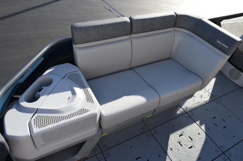 Slide: The Image of 2026 Sea-Doo Switch Cruise 21 boat interior with gray seating and storage compartment. - 8
