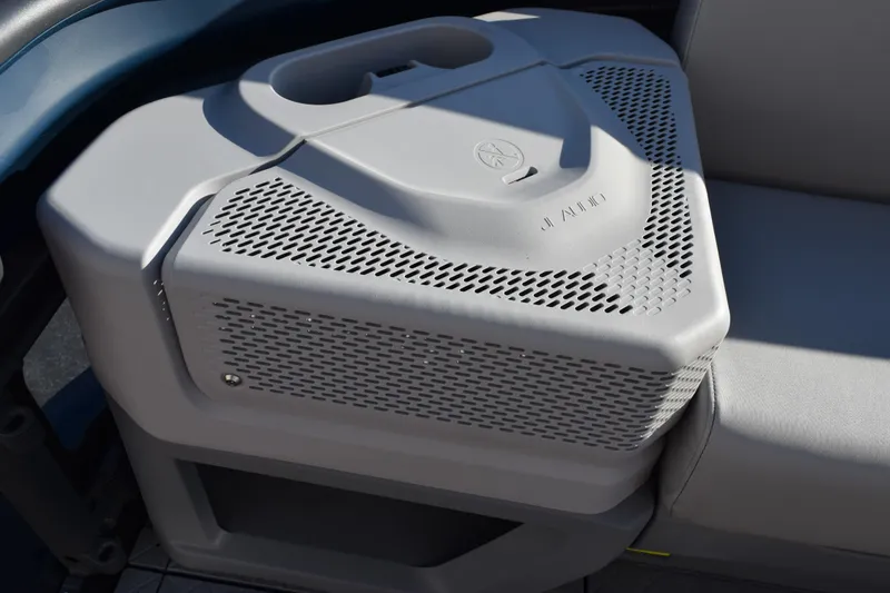 Slide: The Image of 2026 Sea-Doo Switch Cruise 21 speaker detail with integrated cup holder. - 9