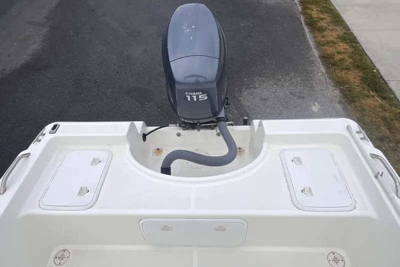Slide: The Image of 2003 Cobia 184 Center Console boat with Yamaha 115 outboard motor. - 14