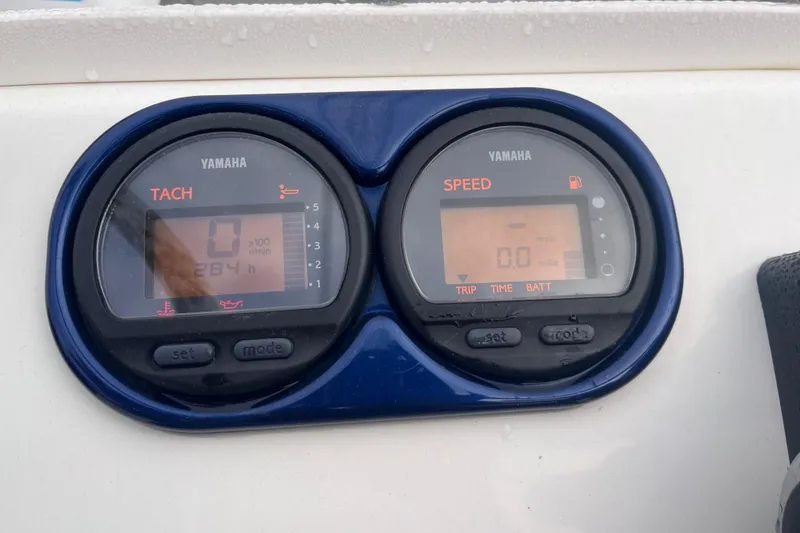 Slide: The Image of Yamaha tachometer and speedometer on 2003 Cobia 184 Center Console boat dashboard. - 16
