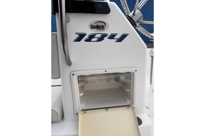 Slide: The Image of 2003 Cobia 184 Center Console boat dashboard with SeaTech Systems logo. - 21