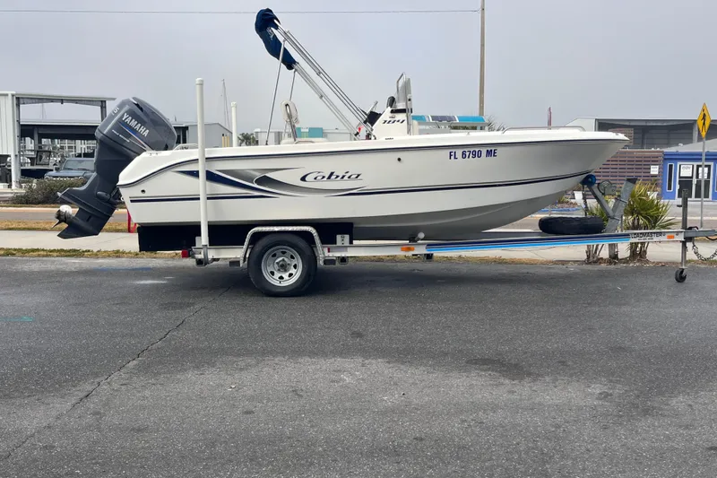 Slide: The Image of 2003 Cobia 184 Center Console boat on trailer with Yamaha outboard motor. - 3
