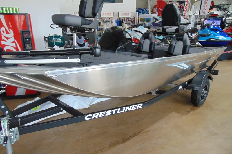 Slide: The Image of 2026 Crestliner 1600 Storm fishing boat on trailer in showroom. - 3