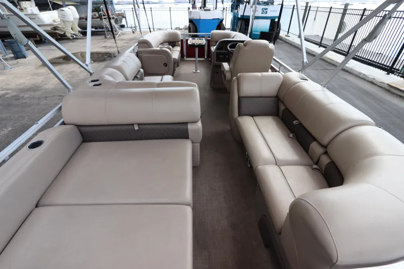 Slide: The Image of 2024 Sun Tracker Party Barge 22 DLX interior with spacious seating and modern design. - 9