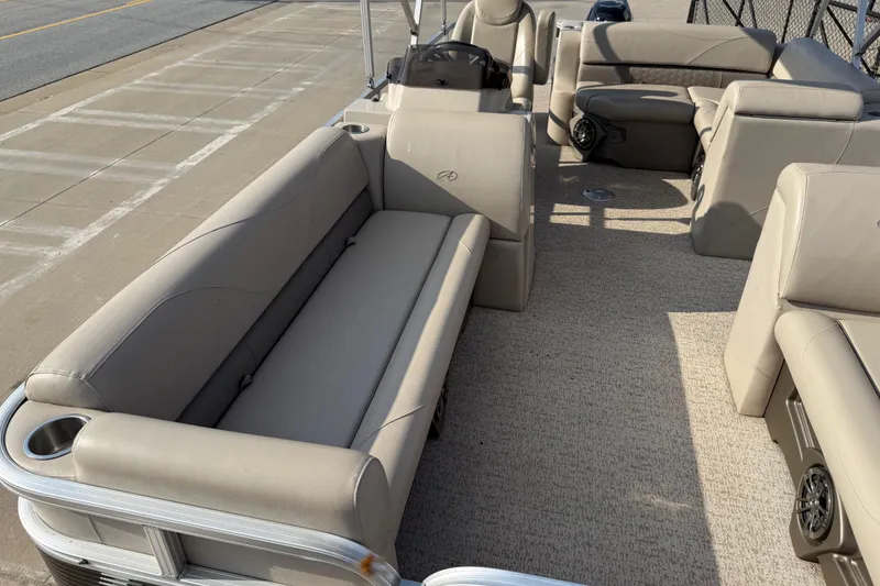 Slide: The Image of 2019 Avalon Venture 1880 CRB pontoon boat with beige seating and spacious interior. - 13