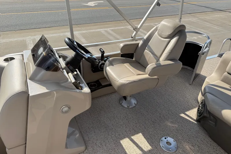 Slide: The Image of 2019 Avalon Venture 1880 CRB boat interior with captain's chair and steering console. - 16