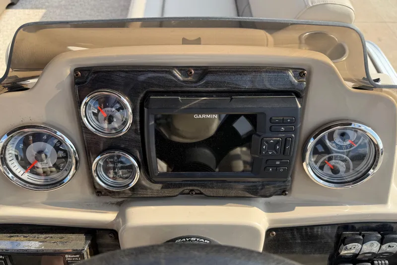 Slide: The Image of Dashboard of 2019 Avalon Venture 1880 CRB with Garmin navigation system and gauges. - 19