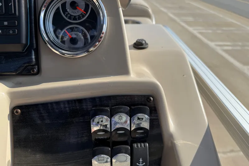 Slide: The Image of Control panel of 2019 Avalon Venture 1880 CRB boat with gauges and switches. - 21